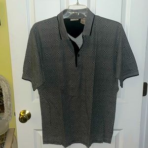 NWOT! Men’s Fila Short Sleeve Polo. 100% Cotton. Black and White. Size Large.